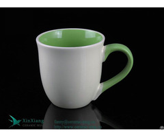 White Trumpet Shaped Ceramic Coffee Cup With Green Handle